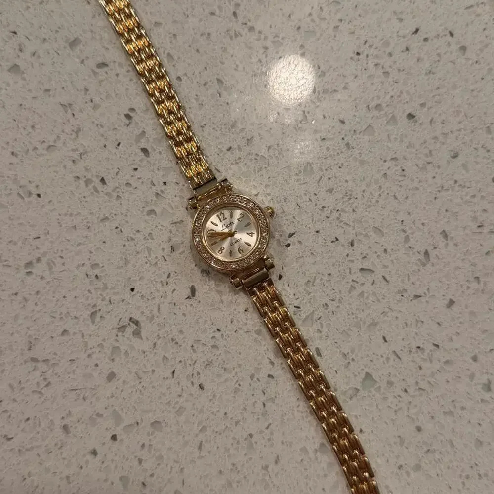 Gold vintage round watch with diamonds
